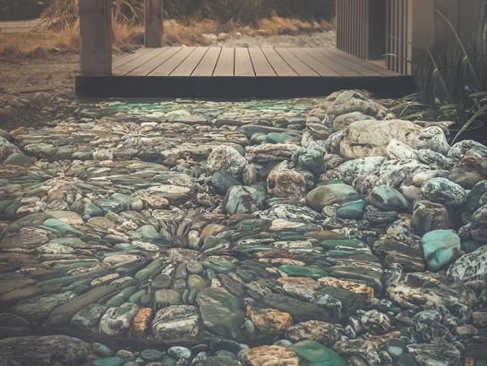 The stone mosaic of the private outdoor seating area is a beautiful touch.