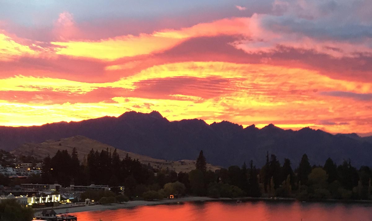 Colourful sunrise behind mountains